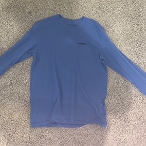 Blue, long-sleeve Patagonia shirt.